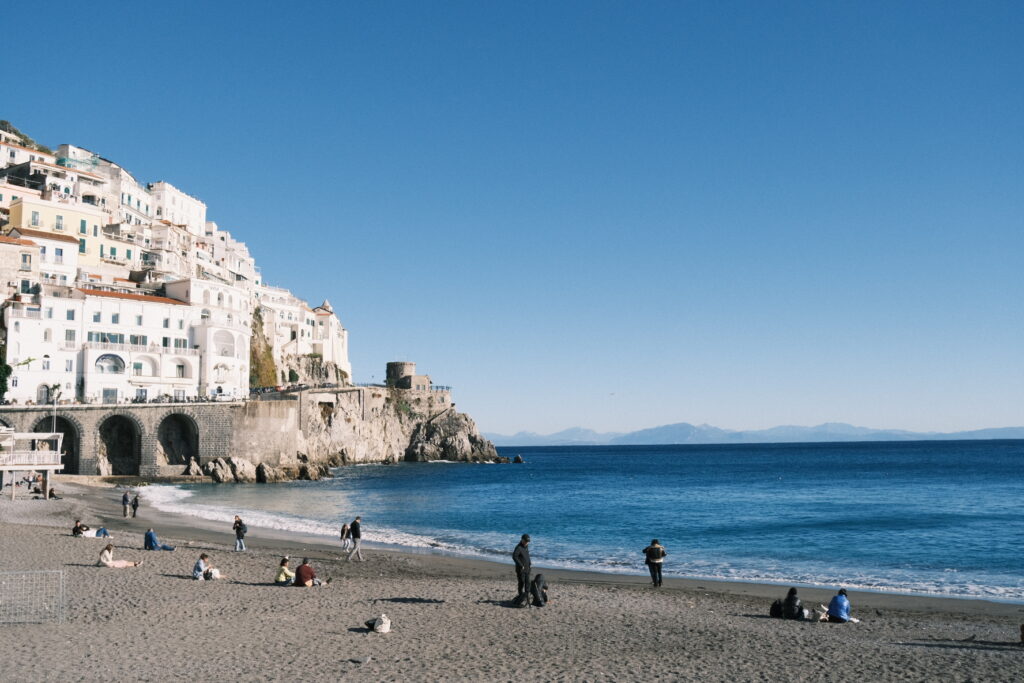 People enjoying the autumn sun on the beach in Amalfi
